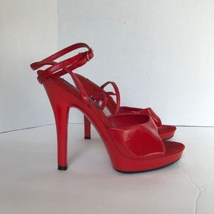 Red patent platform ankle strap stilettos